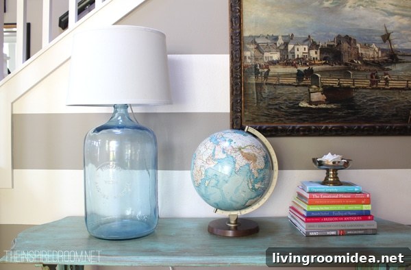 Inspiring Ways to Style Your Latest Flea Market Find 7 Entry table on striped wall with DIY bottle lamp