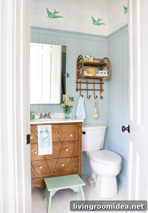 Half Bath with Bird Wallpaper and Wainscoting