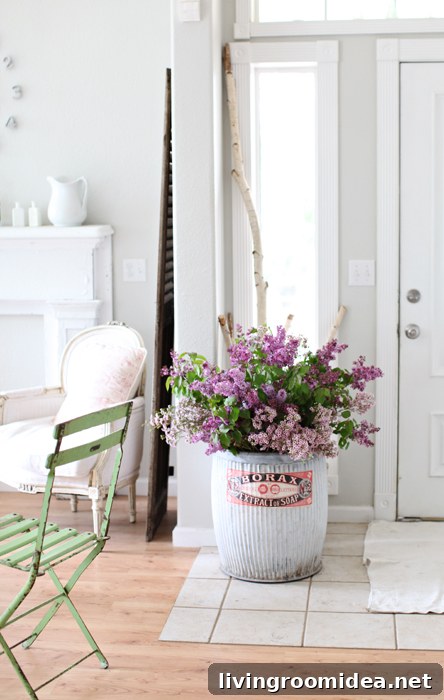 6 Fresh Ways to Bring Spring Charm to Your Entryway 2 Pretty White Entryway with Industrial Bucket of Flowers