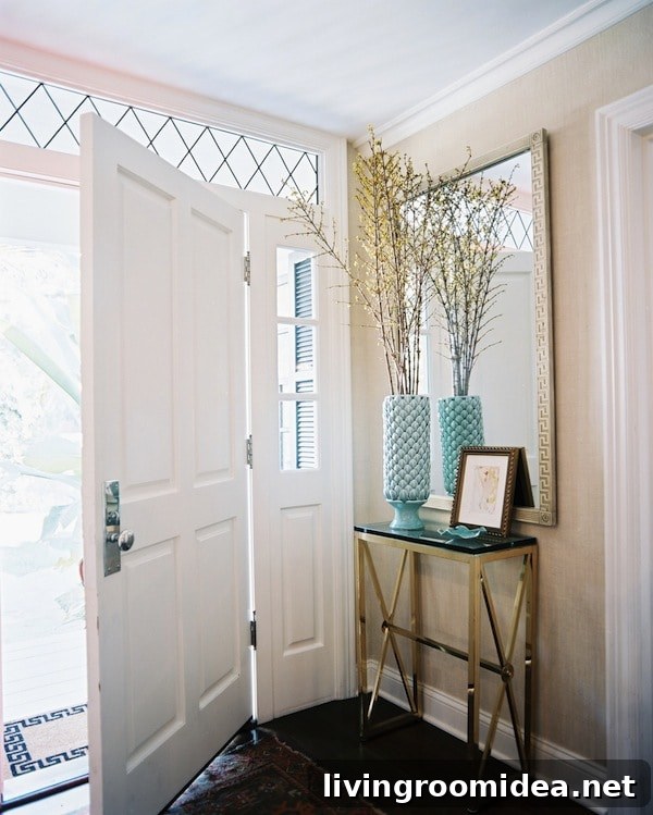 6 Fresh Ways to Bring Spring Charm to Your Entryway 4 Entry with Brass Console Table and Patterned Rug