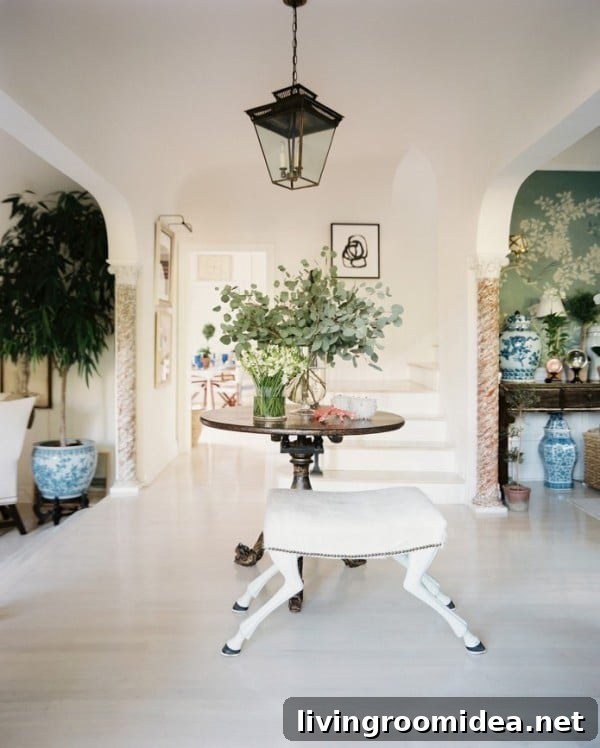8 Dreamy Spaces to Transform Your Home This Year 2 Pretty White Front Entry with Lantern and Round Table