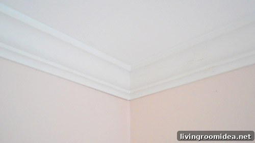 Finished ceiling corner with crown molding installed after caulk