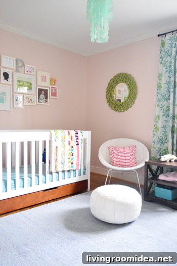 girl's bedroom with pink walls blue carpet and crown molding installed