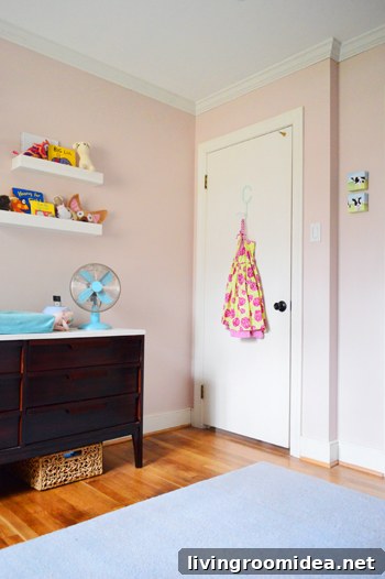 pink girl's bedroom with crown molding on ceiling