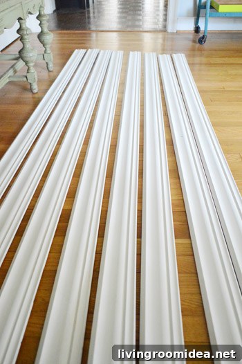 crown molding from Lowe's laid out on floor acclimated to house climate