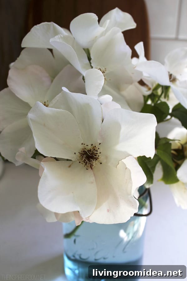 Backyard Garden Update: What’s New This Season 8 Flowers in Blue Mason Jar - The Inspired Room