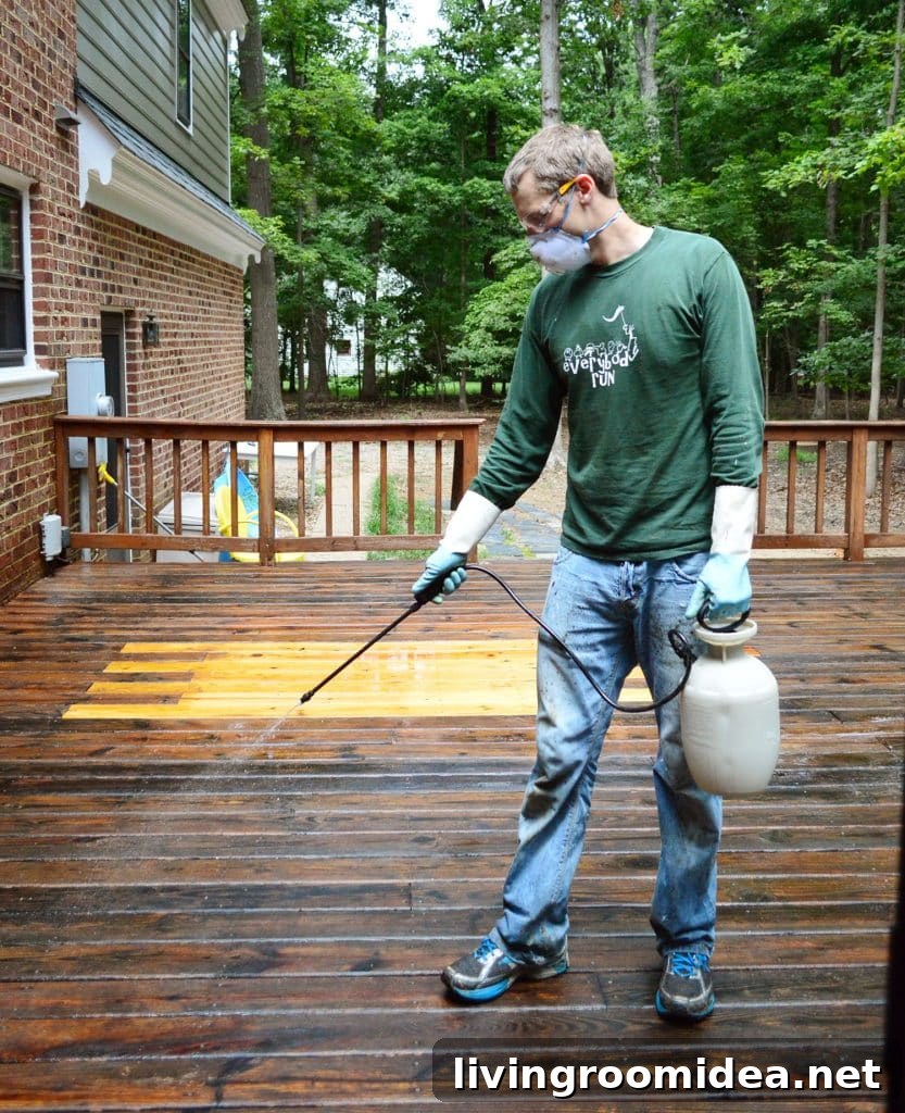 How to Strip a Deck for Staining: Step-by-Step Guide 15 John using pump sprayer to apply deck cleaner brightener