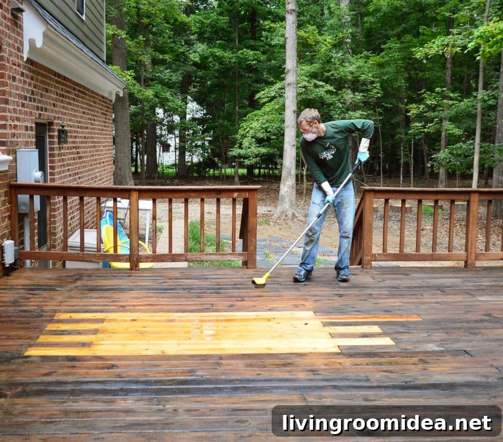 How to Strip a Deck for Staining: Step-by-Step Guide 16 John scrubbing wood deck with deck brightener cleaner