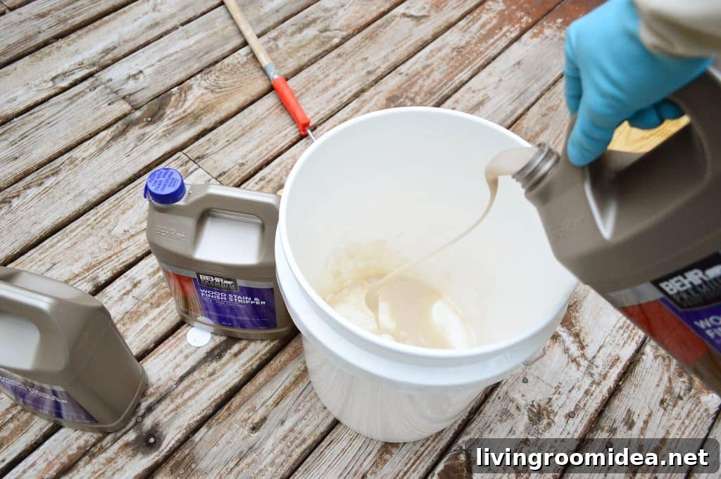 How to Strip a Deck for Staining: Step-by-Step Guide 8 Pouring deck stripper into a bucket