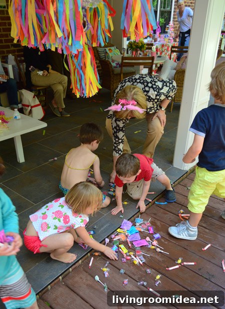 Kids gathering pinata treats