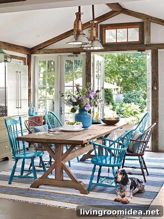 Casual Kitchen Dining Room with Wood Trestle Table and Mismatched Painted Chairs