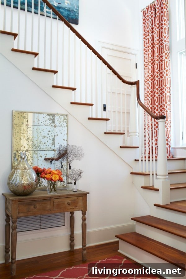 Tracey Interiors - White and Wood Stairway with Coral Accents