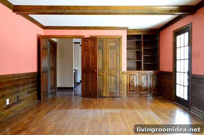 built-in bookshelf in wood paneling living room