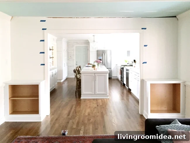 Painters Tape On Wall To Determine Spacing of DIY built-in bookshelves