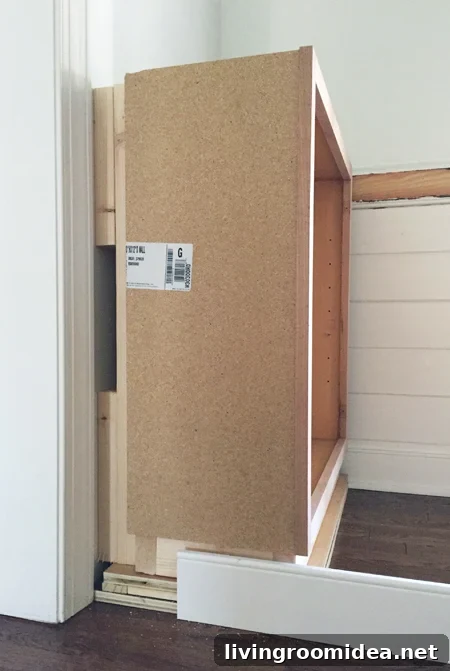Blocking behind base cabinet for built-in bookshelf