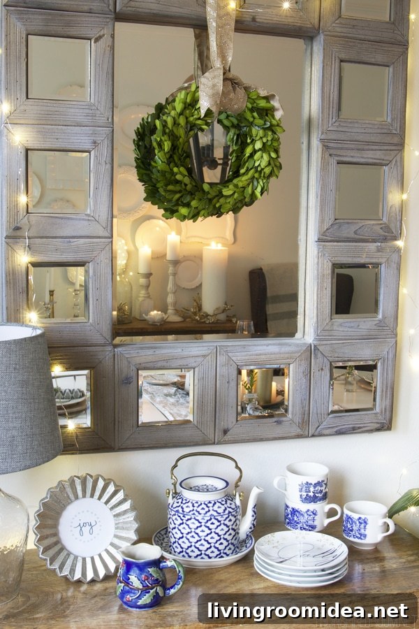 Boxwood wreath hung on a mirror - Dining room Christmas decorating - The Inspired Room