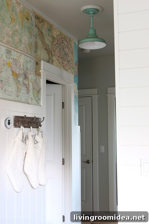 Map Wallpapered Hallway - White Stockings on Hooks - The Inspired Room Christmas House Tour