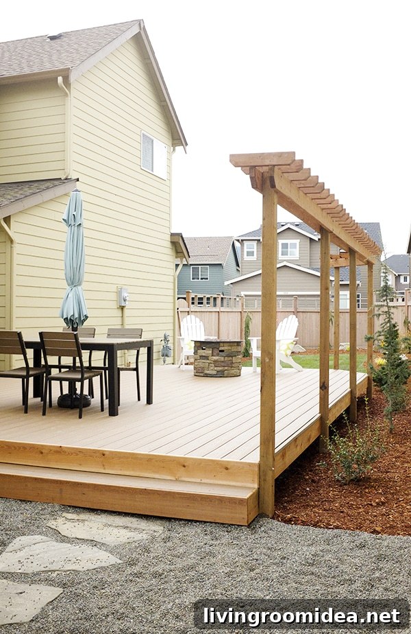 Small backyard with pea gravel and Trex deck