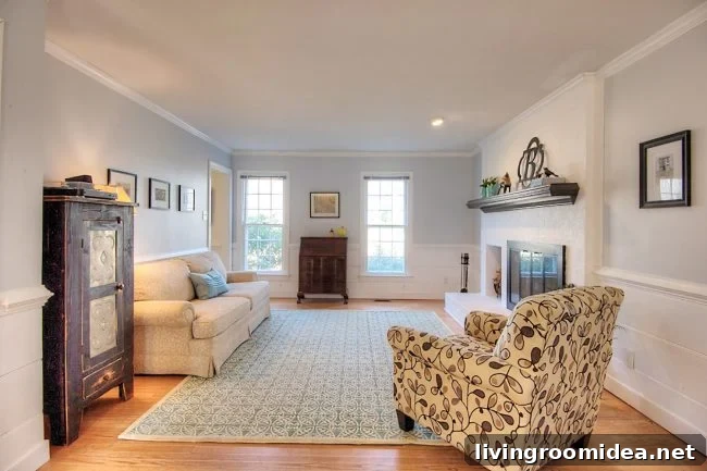 living room staged to sell with neutral walls white fireplace and minimal furniture