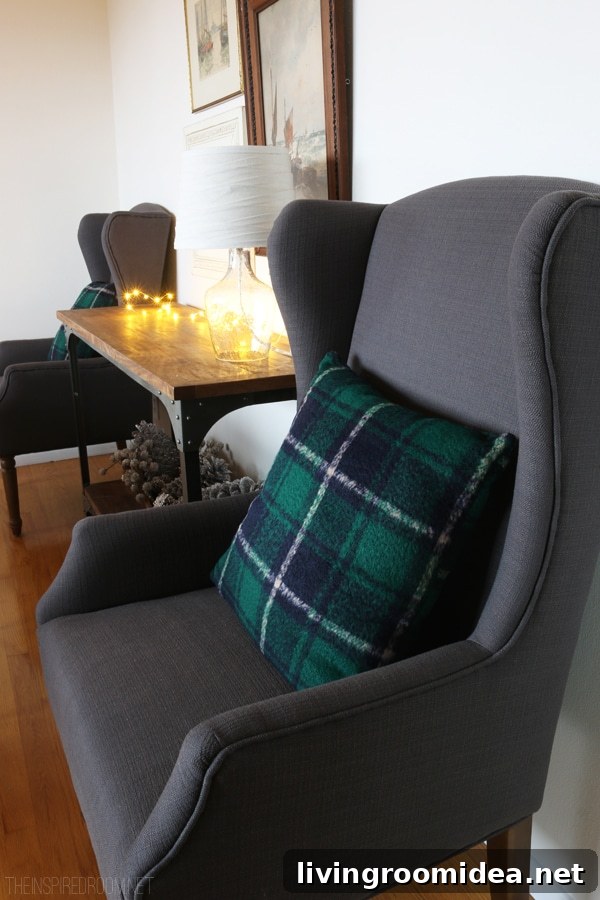 Cozy Glam Holiday Tablescape: 8 Stylish Decorating Tips 8 Plaid Pillows and Gray Wingback Chairs - The Inspired Room