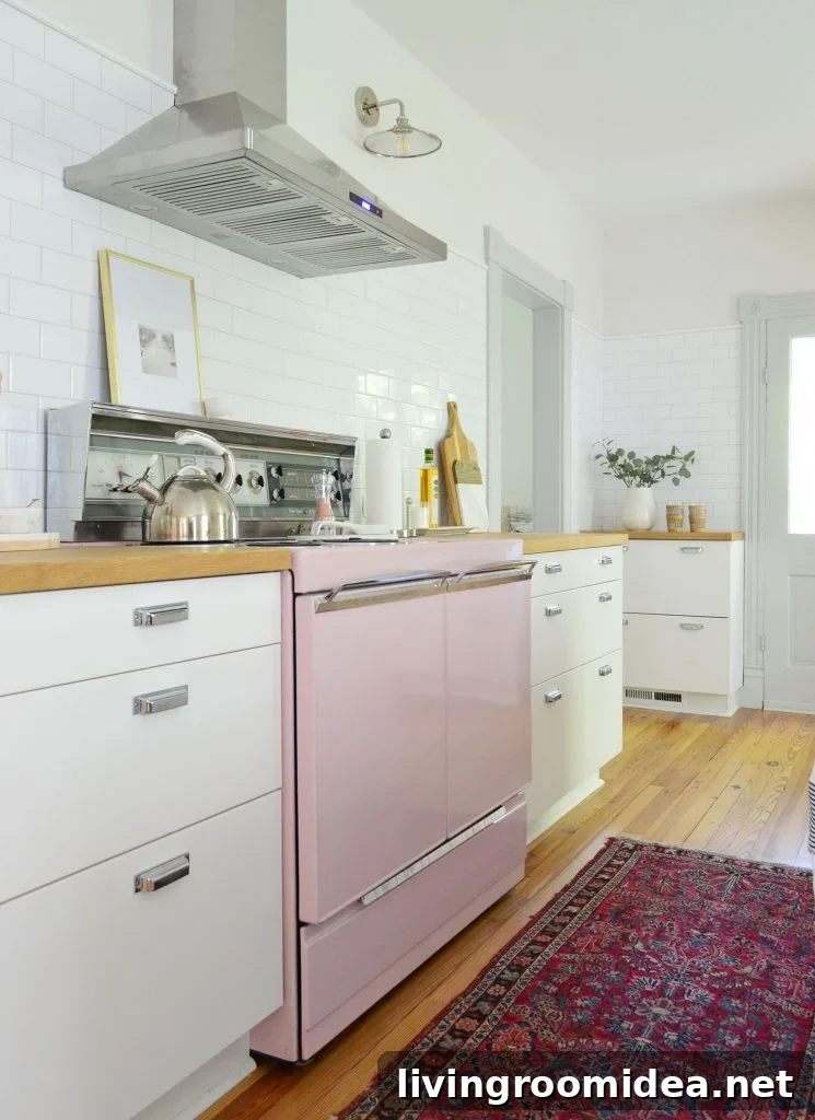 beach house kitchen with pink stove and white subway backsplash