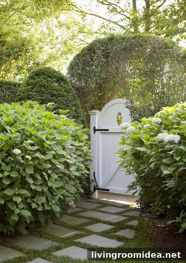 Painted White Gate - Round with Oval Cutout and Black Iron Hardware - Design by Jenny Wolf - Photo by Emily Gilbert