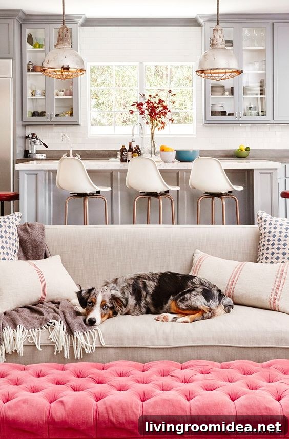 Gray and White Living Space with Pink Tufted Ottoman - Constance Zimmer