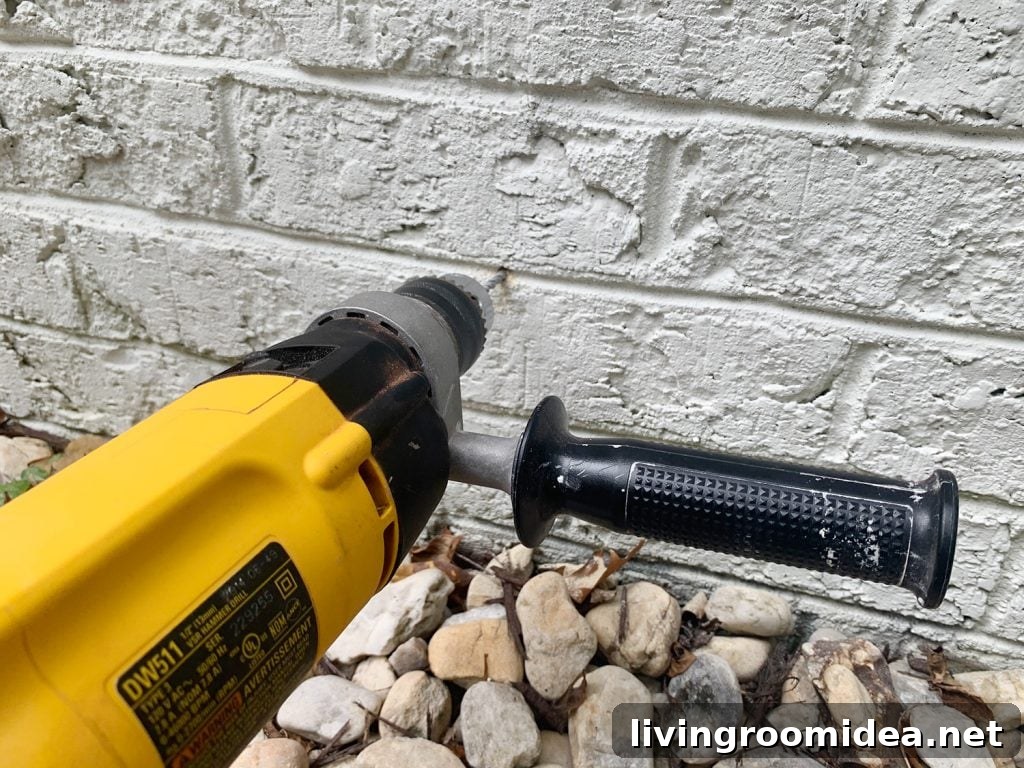 Hammer Drilling Making Hole In Brick Wall
