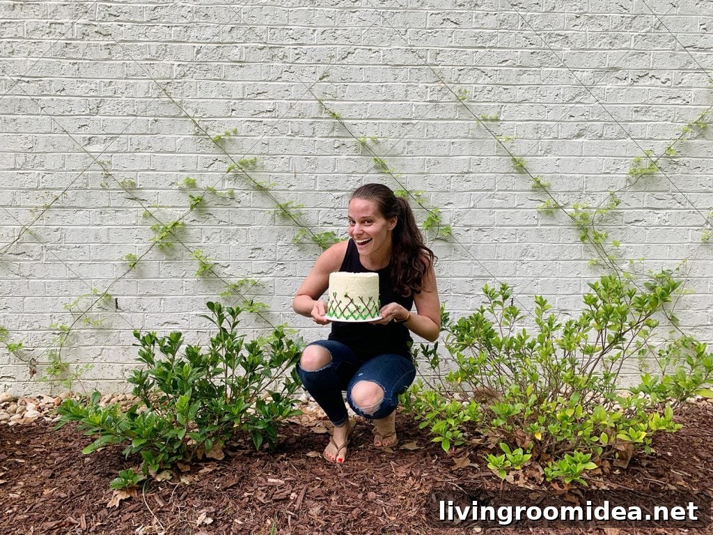 Sherry posing in front of vine diamond trellis with matching cake