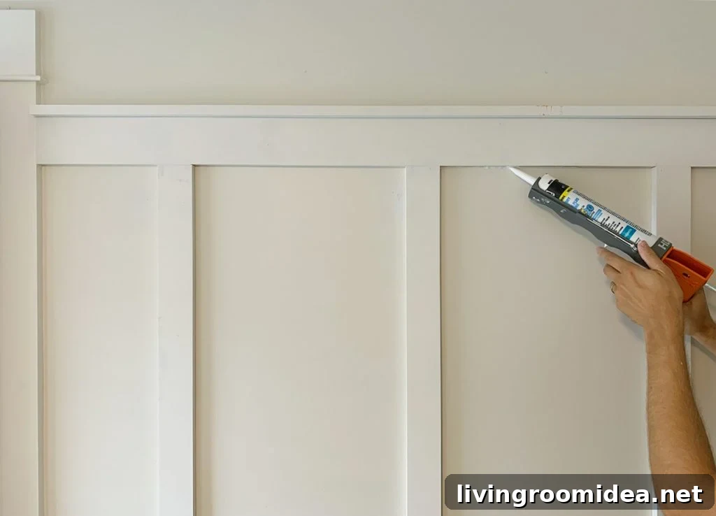 Board and Batten Tutorial: Step-by-Step Wall Installation Guide 15 Applying Caulk Bead To Seams On Board And Batten Installation