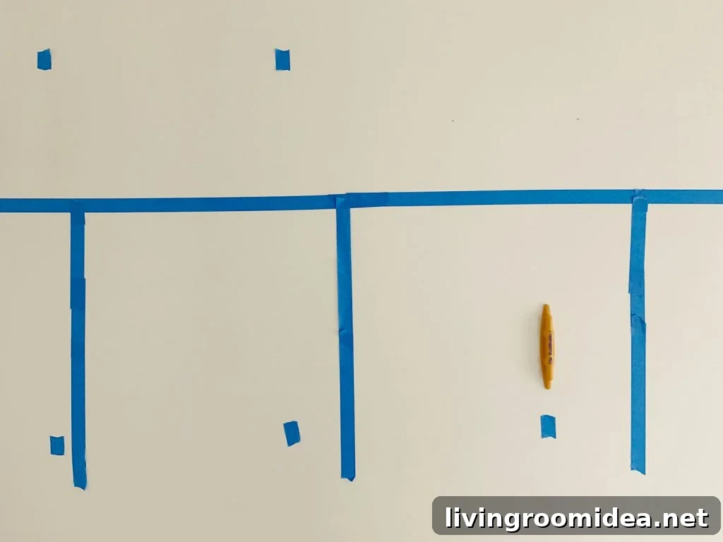 Board and Batten Tutorial: Step-by-Step Wall Installation Guide 7 Marking Studs With Blue Painters Tape Using Stud Buddy Tool