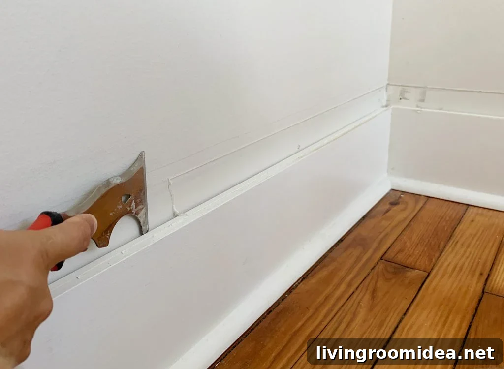 Board and Batten Tutorial: Step-by-Step Wall Installation Guide 9 Scraping Old Caulk For Smooth Wall Above Baseboard