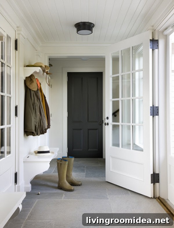 Entry Hallway - Paneled Ceiling with Black Door and Tile Floors