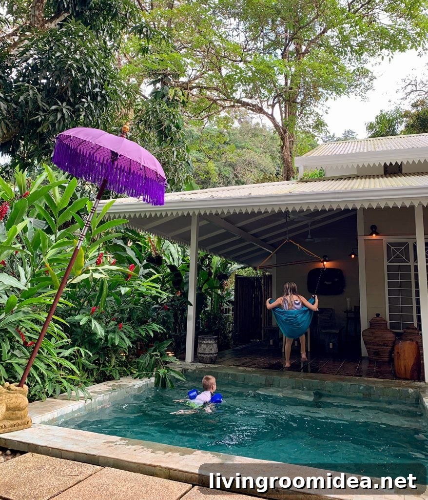 Kids Playing At Tropical Airbnb In Costa Rica With Pool And Swing