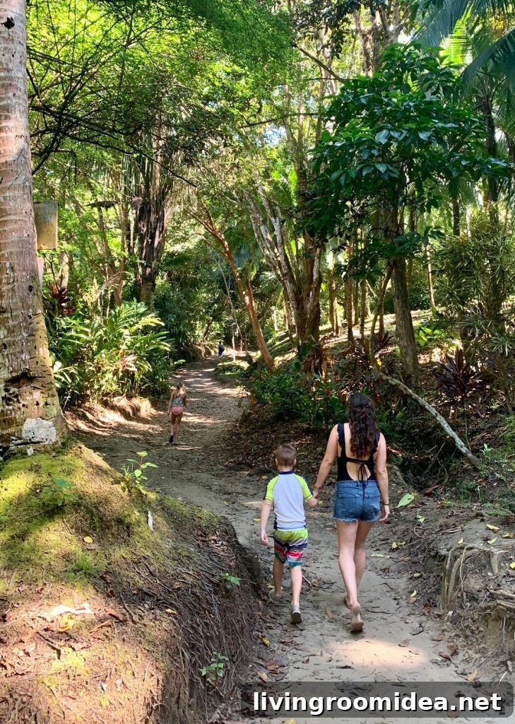 Mom Walking With Young Kids To Secret Playa Biesanz Beach In Costa Rica