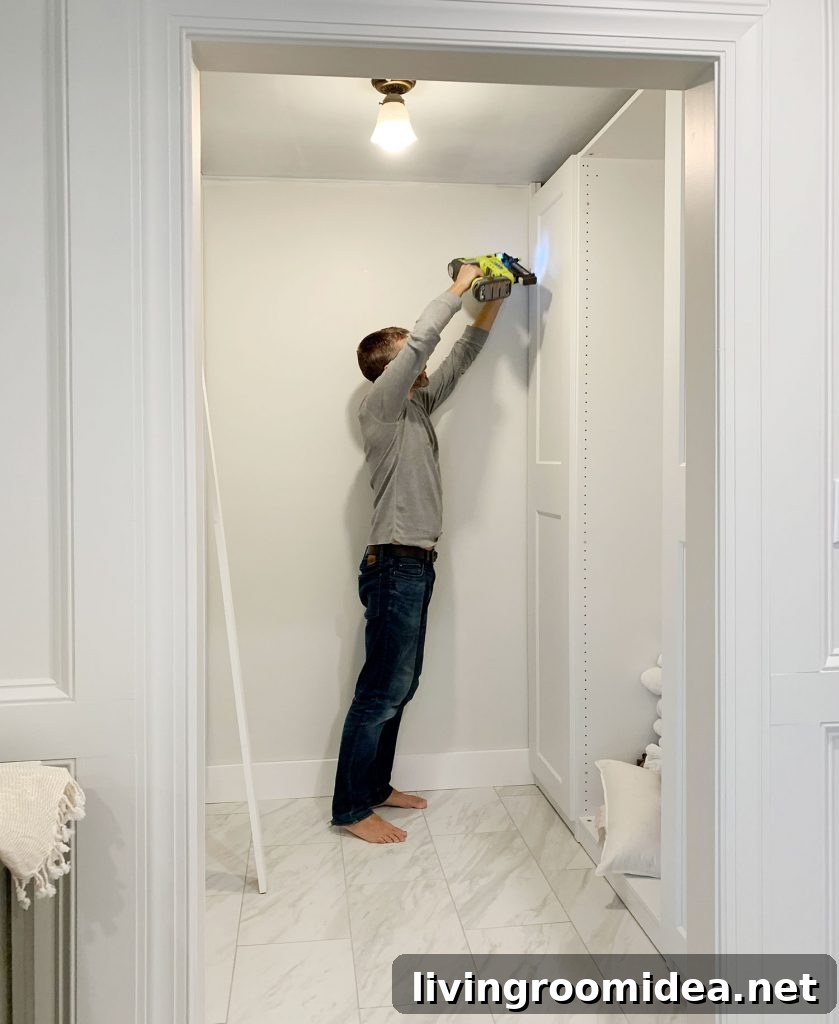 IKEA PAX Closet Makeover: Budget Breakdown + Video Tour 13 John Nailing Boards In Remodeled Ikea Closet