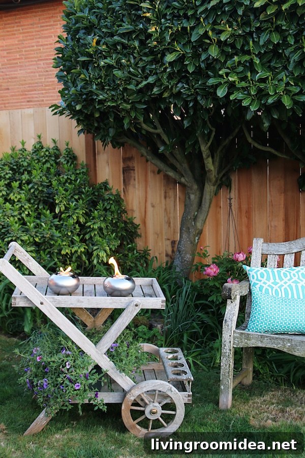 Designing an Inviting Backyard: Secrets to a Cozy Outdoor Space 9 The Inspired Room Outdoor Space - Teak Bar Cart with Tabletop Tiki Torches
