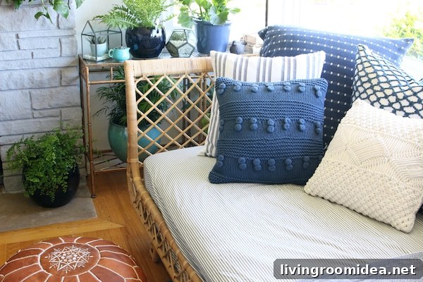 Rattan Daybed: Cozy Window Corner for Relaxing Views 10 Rattan Daybed - Blue and White Pillows - The Inspired Room