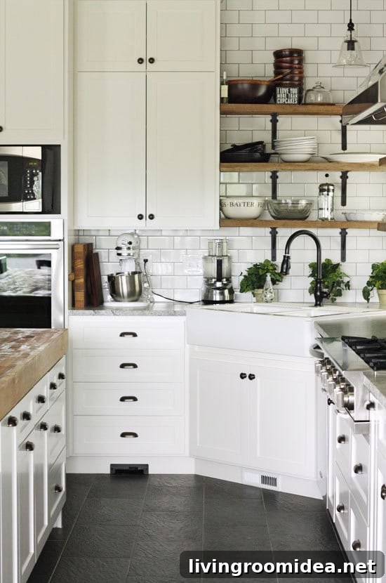 Inspiration for Kitchens with Black Hardware - Black White and Wood Kitchen with Slate Floors