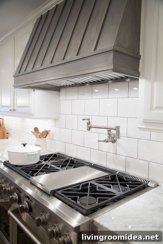 Fixer Upper Farmhouse Kitchen by Chip and Joanna Gaines - Gray Stained Wood Covered Range Hood
