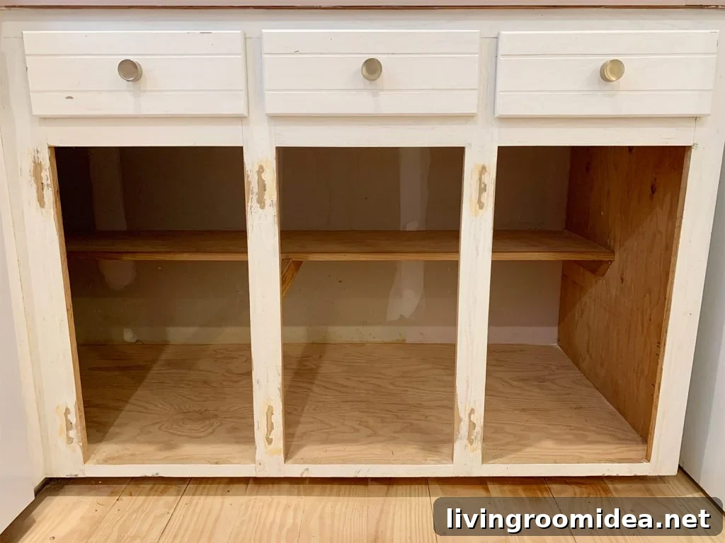 Three lower cabinet frames sanded and holes filled with wood filler