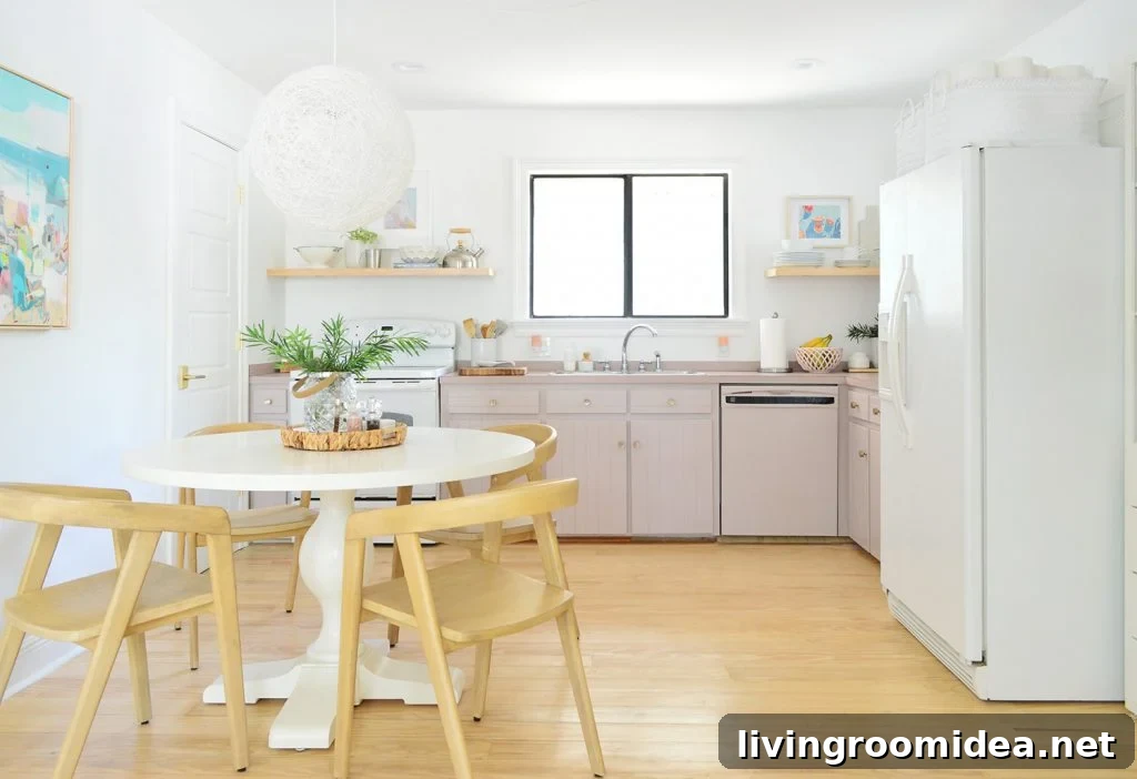 Full view of simple white kitchen with mauve lower cabinets | Sherwin Williams Artsy Pink