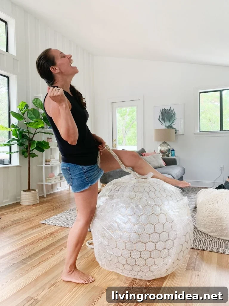 Sherry Pretending To Reenact Miley Cyrus Wrecking Ball On Large Capiz Globe Light