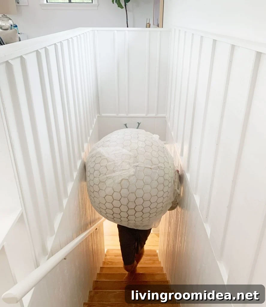 Oversized Capiz Globe Light Narrowly Fitting Up Stairs
