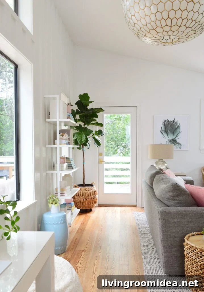 View Of Door To Deck Behind Couch With Large Capiz Light Fixture Overhead