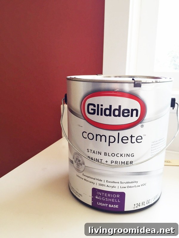 Click through to see how we painted our red wall to white and be inspired for how you could transform your home - Glidden Complete stain blocking paint and primer.