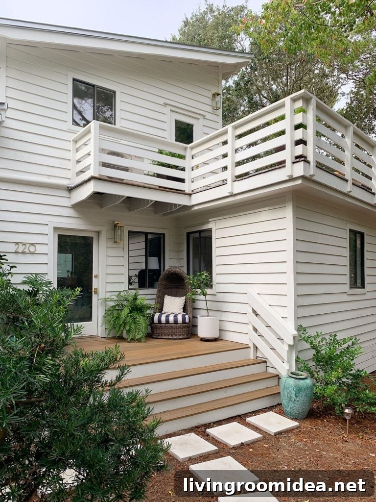 Two Levels Of Porches On White House With Horizontal Railings