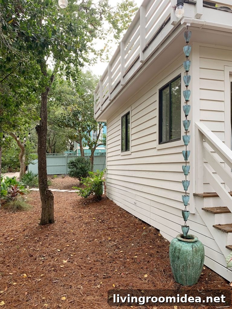 Copper Patina Rain Chain On Corner Of House Into Green Pot