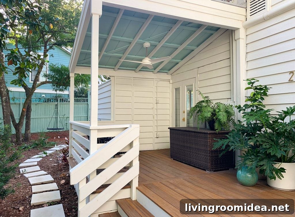 Covered Porch With Painted Blue Ceiling And White Ceiling Fan