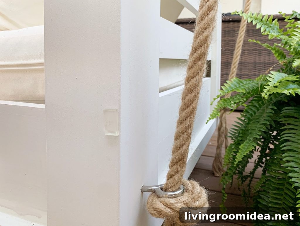 Clear furniture bumper on backside of white hanging daybed
